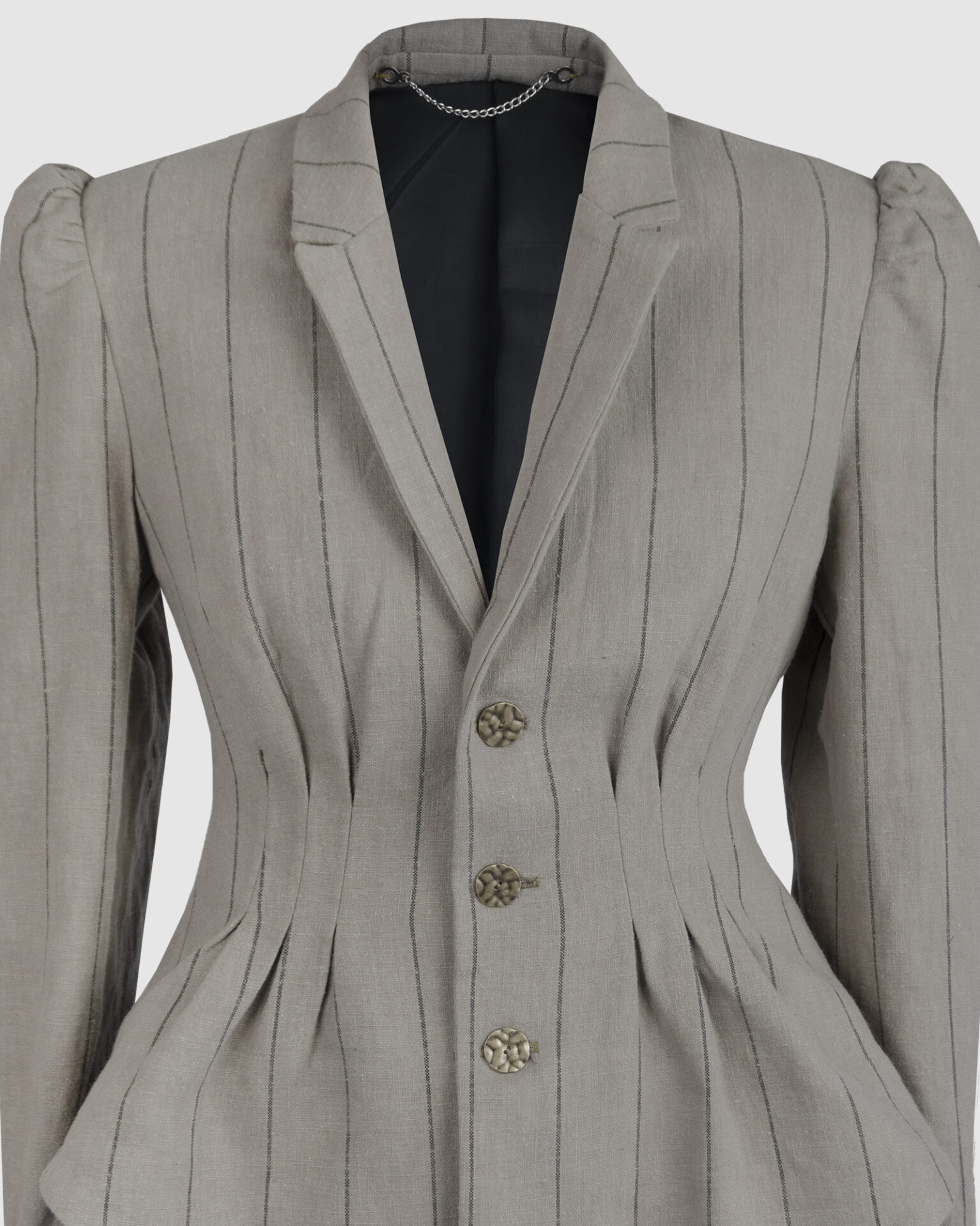 Fitted, single-breasted cotton velvet jacket with narrow peak lapels, released tucks at the waist, side seam pockets, and a softly pointed front hem.