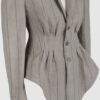 Fitted, single-breasted cotton velvet jacket with narrow peak lapels, released tucks at the waist, side seam pockets, and a softly pointed front hem.