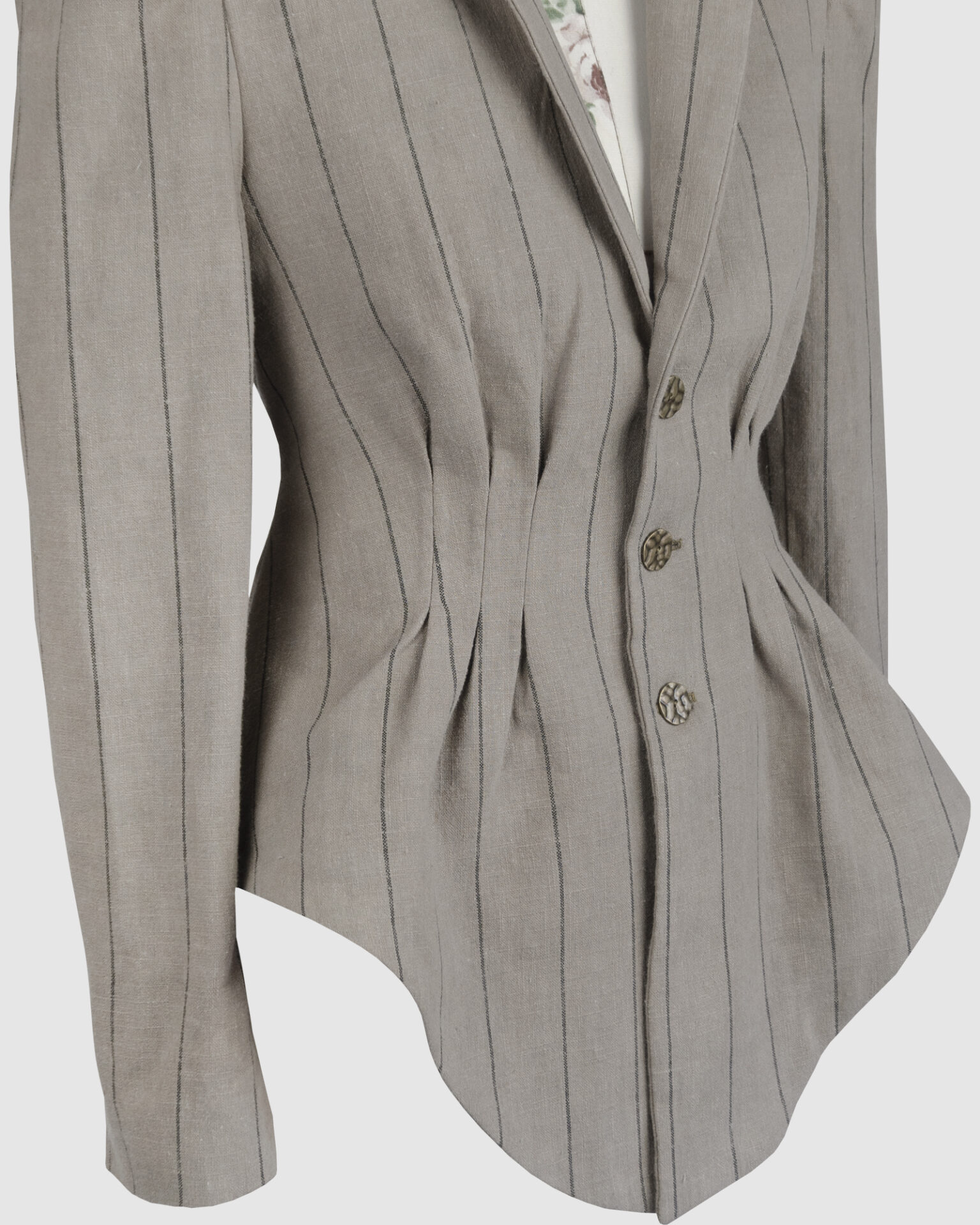 Fitted, single-breasted cotton velvet jacket with narrow peak lapels, released tucks at the waist, side seam pockets, and a softly pointed front hem.