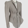 Fitted, single-breasted cotton velvet jacket with narrow peak lapels, released tucks at the waist, side seam pockets, and a softly pointed front hem.