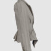Fitted, single-breasted cotton velvet jacket with narrow peak lapels, released tucks at the waist, side seam pockets, and a softly pointed front hem.