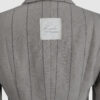 Semi-fitted double-breasted jacket with peak lapels, a welt breast pocket, and pockets with asymmetrical flaps. Designed in a 4x1 configuration