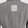Semi-fitted double-breasted jacket with peak lapels, a welt breast pocket, and pockets with asymmetrical flaps. Designed in a 4x1 configuration