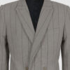 Semi-fitted double-breasted jacket with peak lapels, a welt breast pocket, and pockets with asymmetrical flaps. Designed in a 4x1 configuration