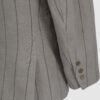 Semi-fitted double-breasted jacket with peak lapels, a welt breast pocket, and pockets with asymmetrical flaps. Designed in a 4x1 configuration