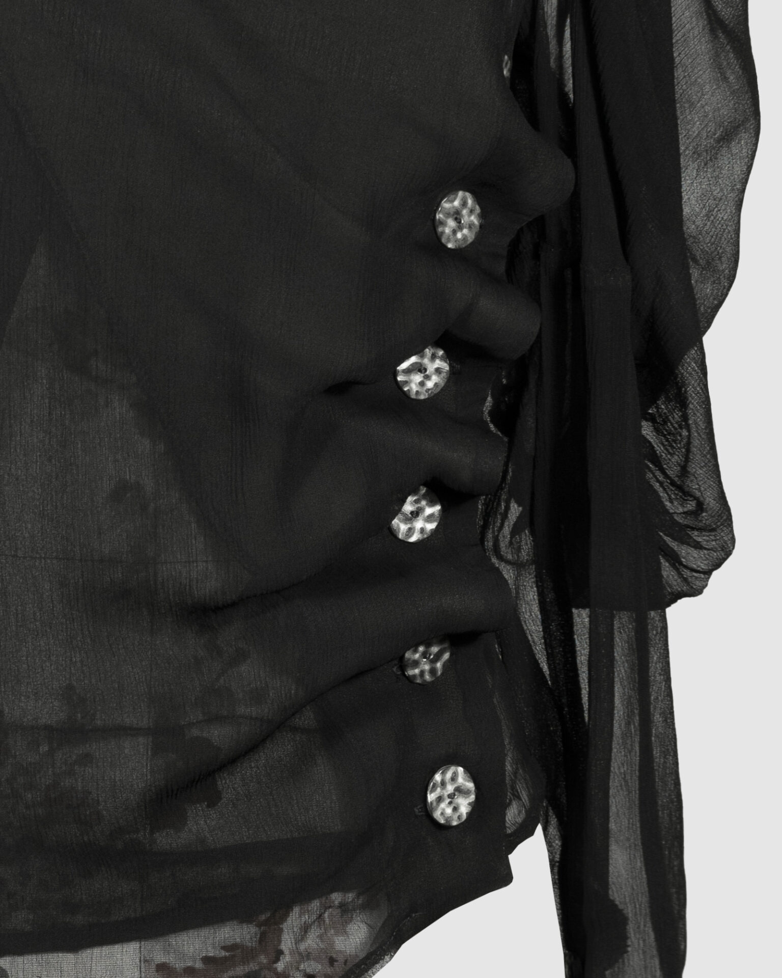 Fitted blouse with a draped front and voluminous sleeves