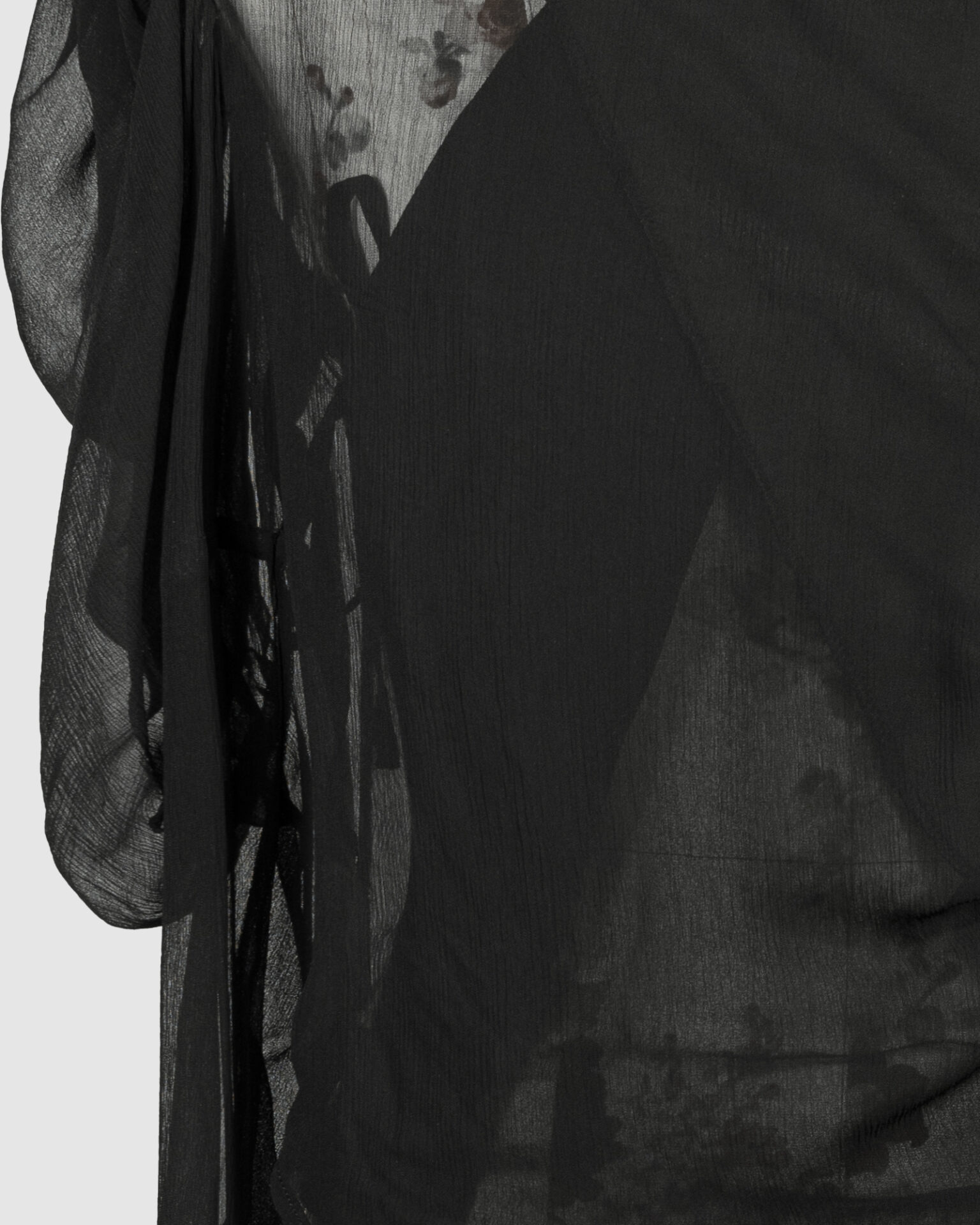 Fitted blouse with a draped front and voluminous sleeves