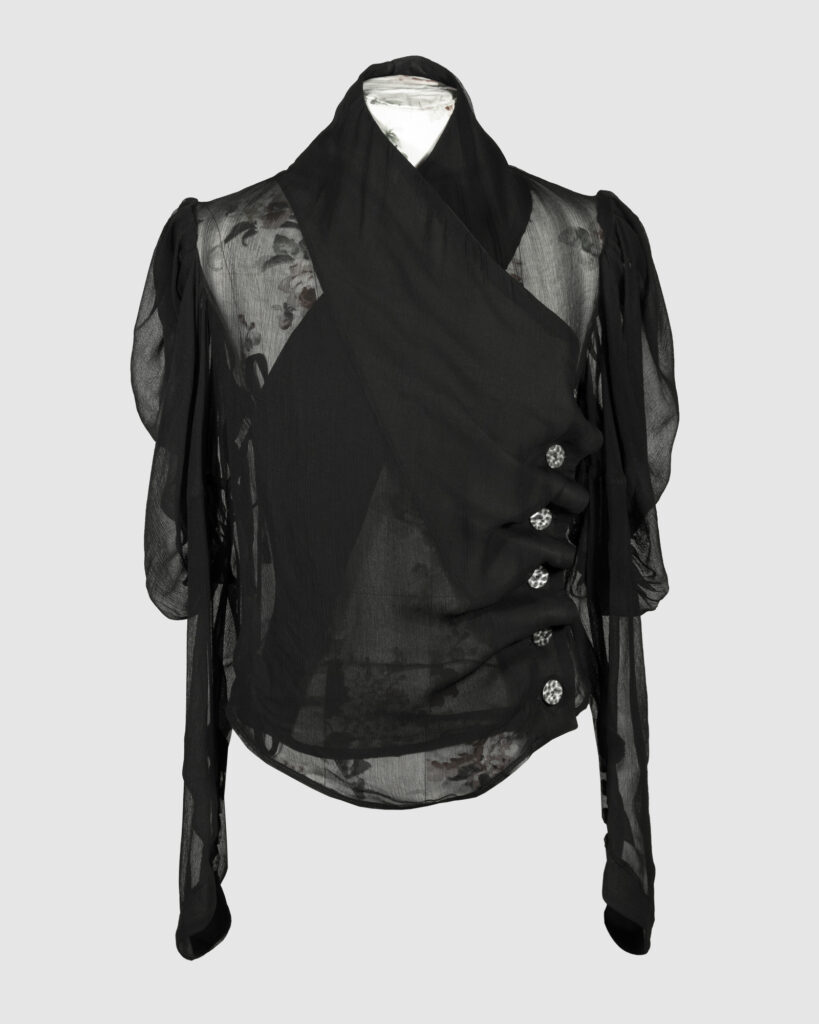 Fitted blouse with a draped front and voluminous sleeves