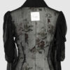 Fitted blouse with a draped front and voluminous sleeves