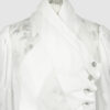 Fitted blouse with a draped front and voluminous sleeves
