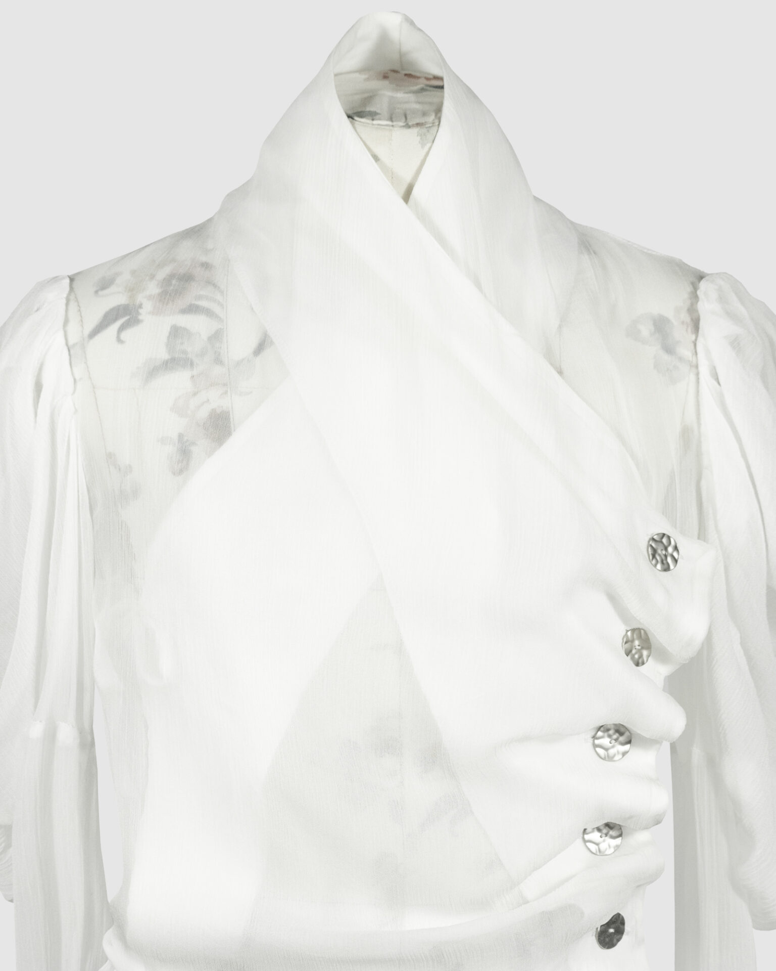 Fitted blouse with a draped front and voluminous sleeves
