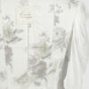 Fitted blouse with a draped front and voluminous sleeves