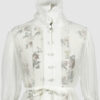 The loose-fitting blouse made of pure silk