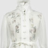 The loose-fitting blouse made of pure silk