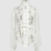 The loose-fitting blouse made of pure silk