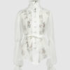 The loose-fitting blouse made of pure silk