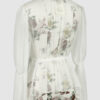 The loose-fitting blouse made of pure silk