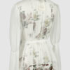 The loose-fitting blouse made of pure silk