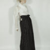 Fitted blouse with a draped front and voluminous sleeves The piece is inspired by traditional Japanese hakama trousers. It is a pair of wide-legged trousers with a high waistband.