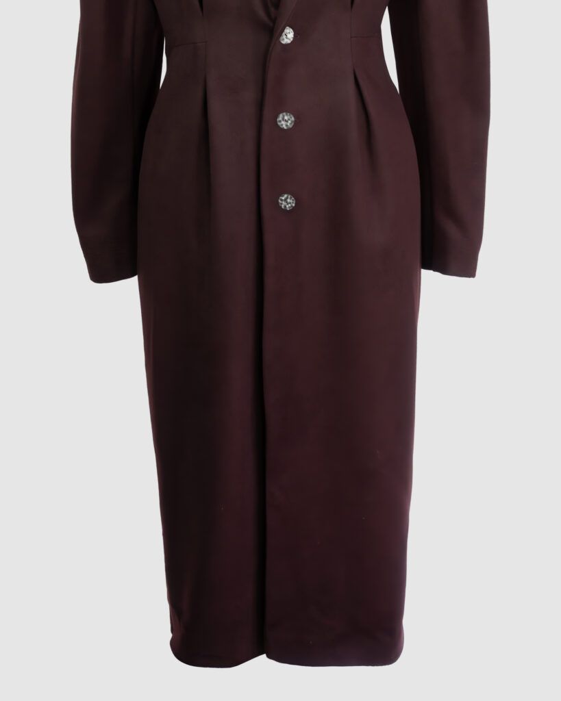 Coat with draped sleeves