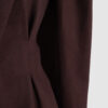Coat with draped sleeves