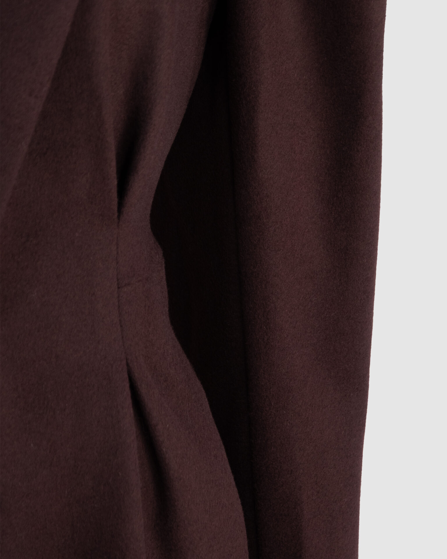 Coat with draped sleeves