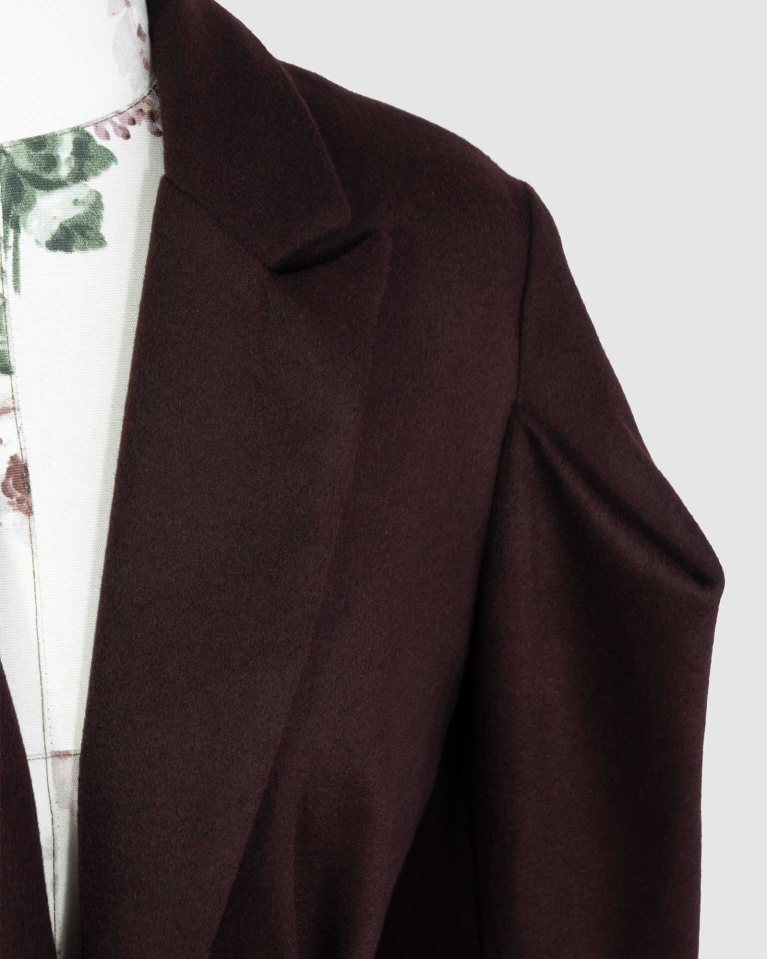 Coat with draped sleeves