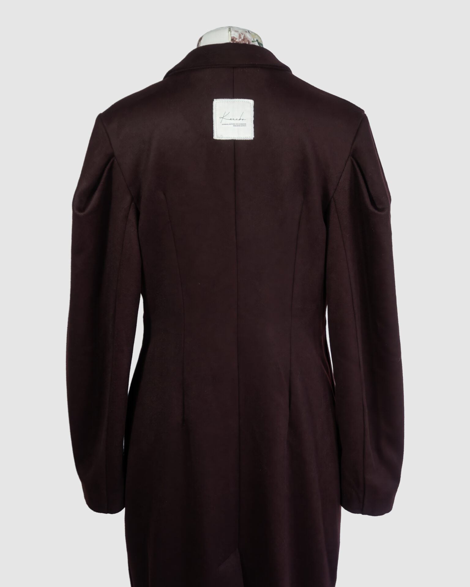 Coat with draped sleeves