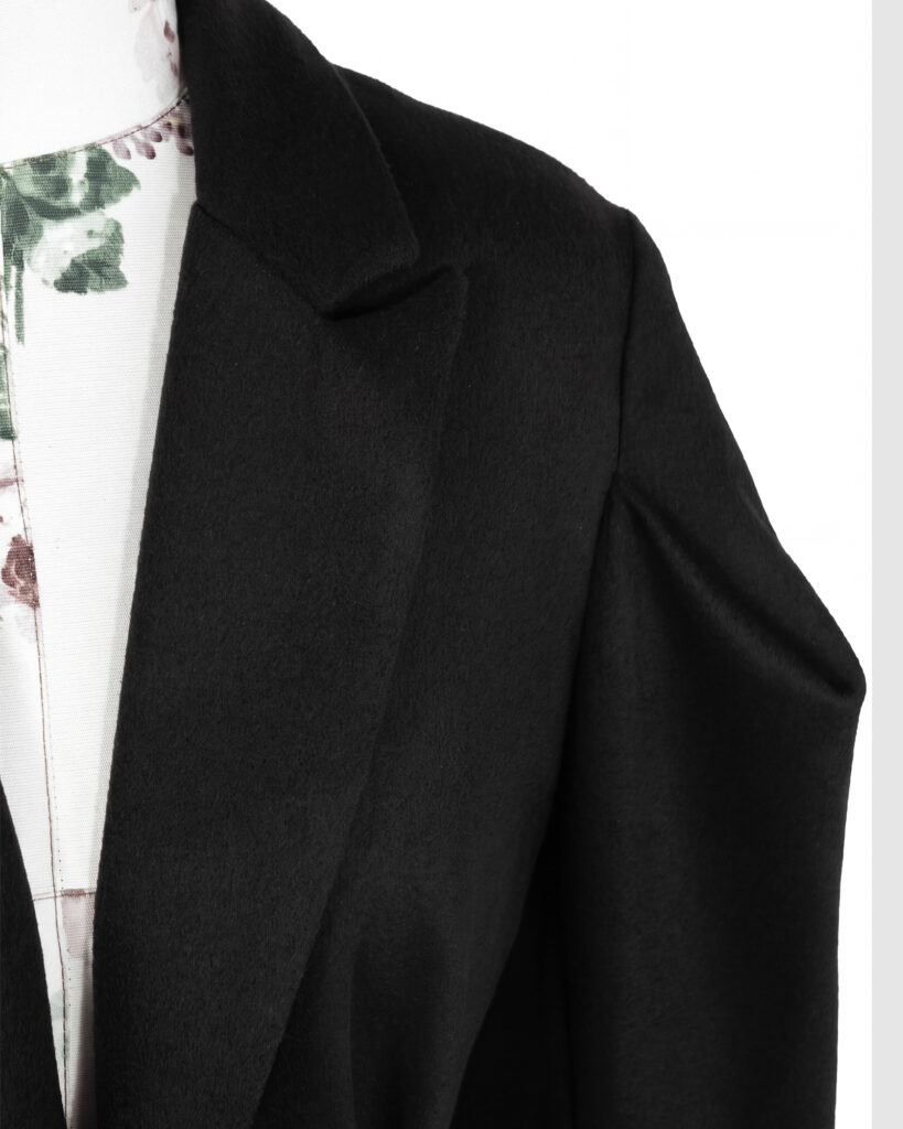 Coat with draped sleeves