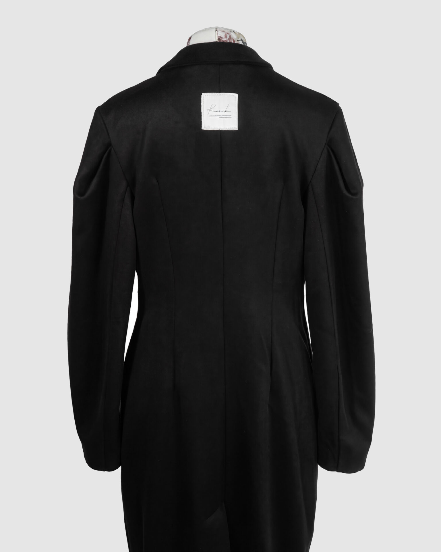 Coat with draped sleeves