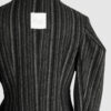 Coat with draped sleeves