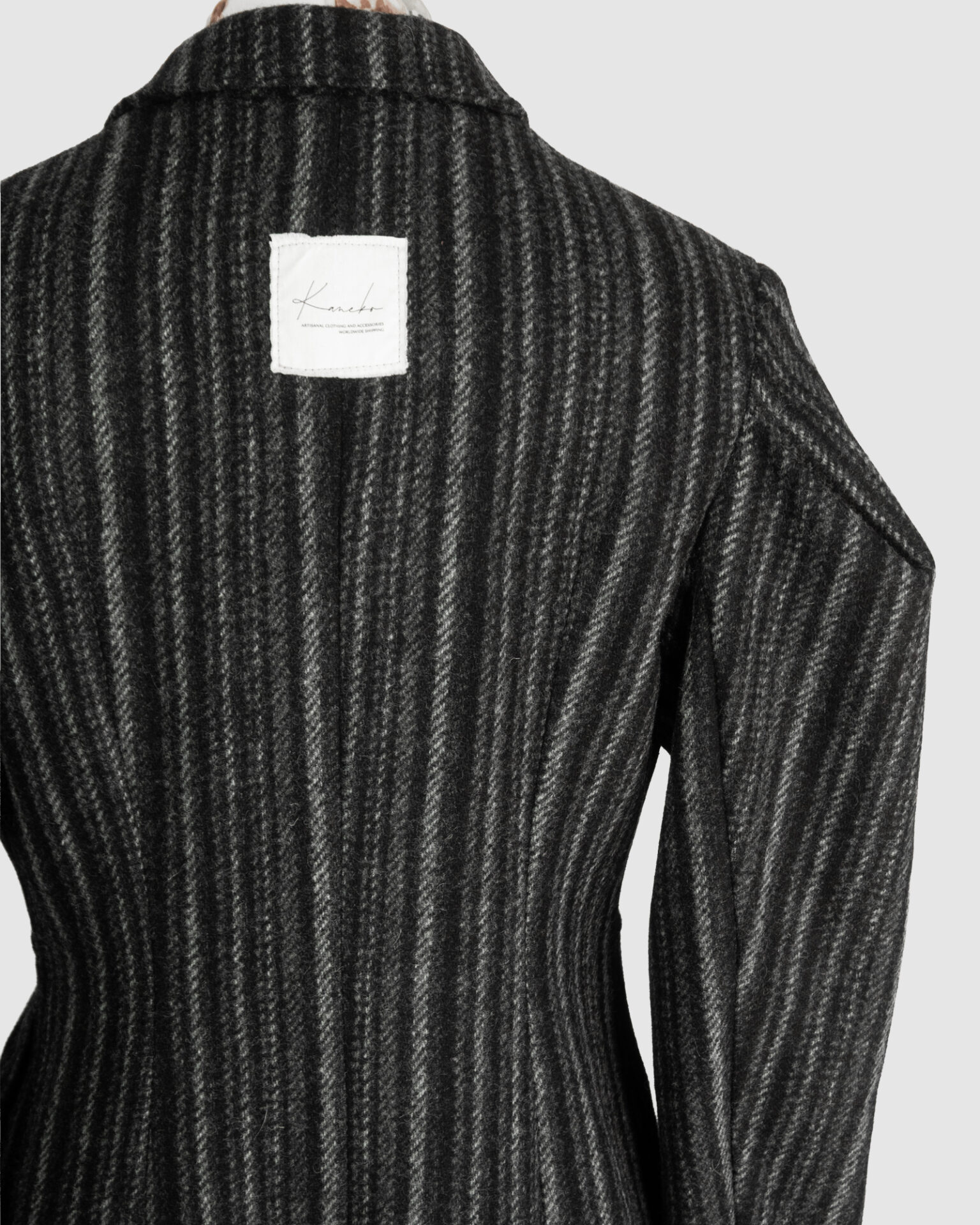 Coat with draped sleeves