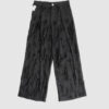 Trousers with overlapping pleats