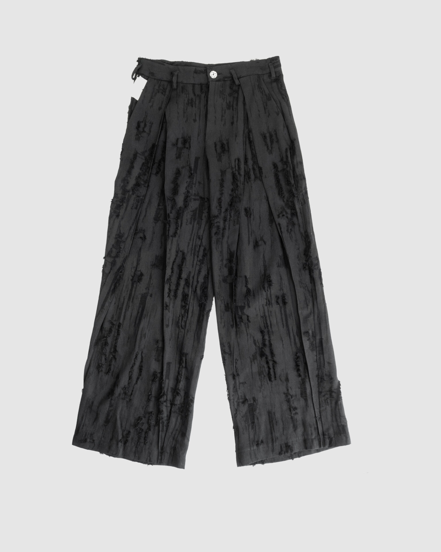 Trousers with overlapping pleats