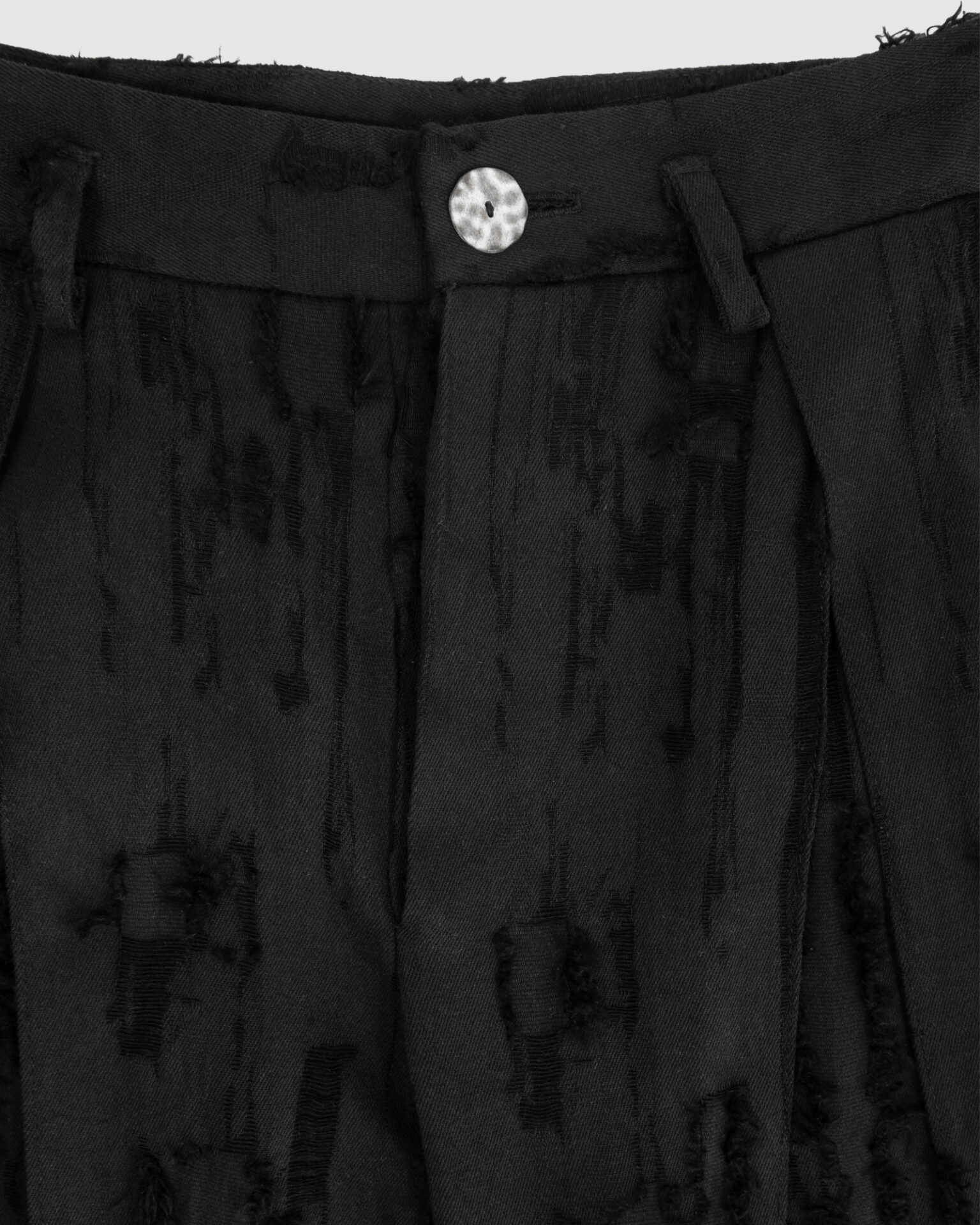 Trousers with overlapping pleats