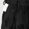 Trousers with overlapping pleats